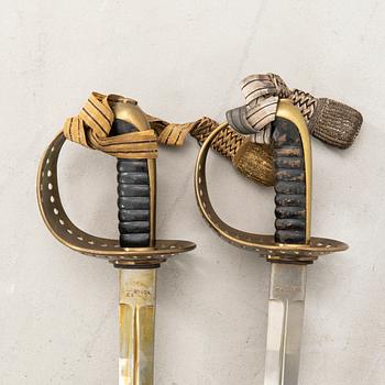 Two Swedish cavalry sabres 1893 pattern, with scabbards.