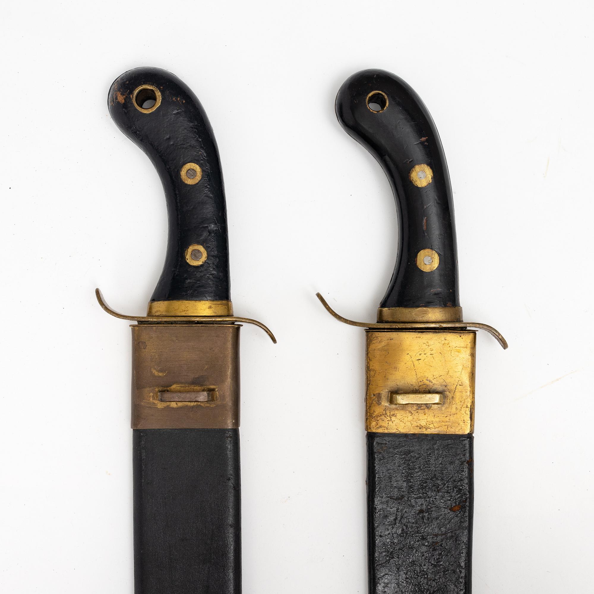 Two Swedish cutlasses 1848 pattern,with scabbards.