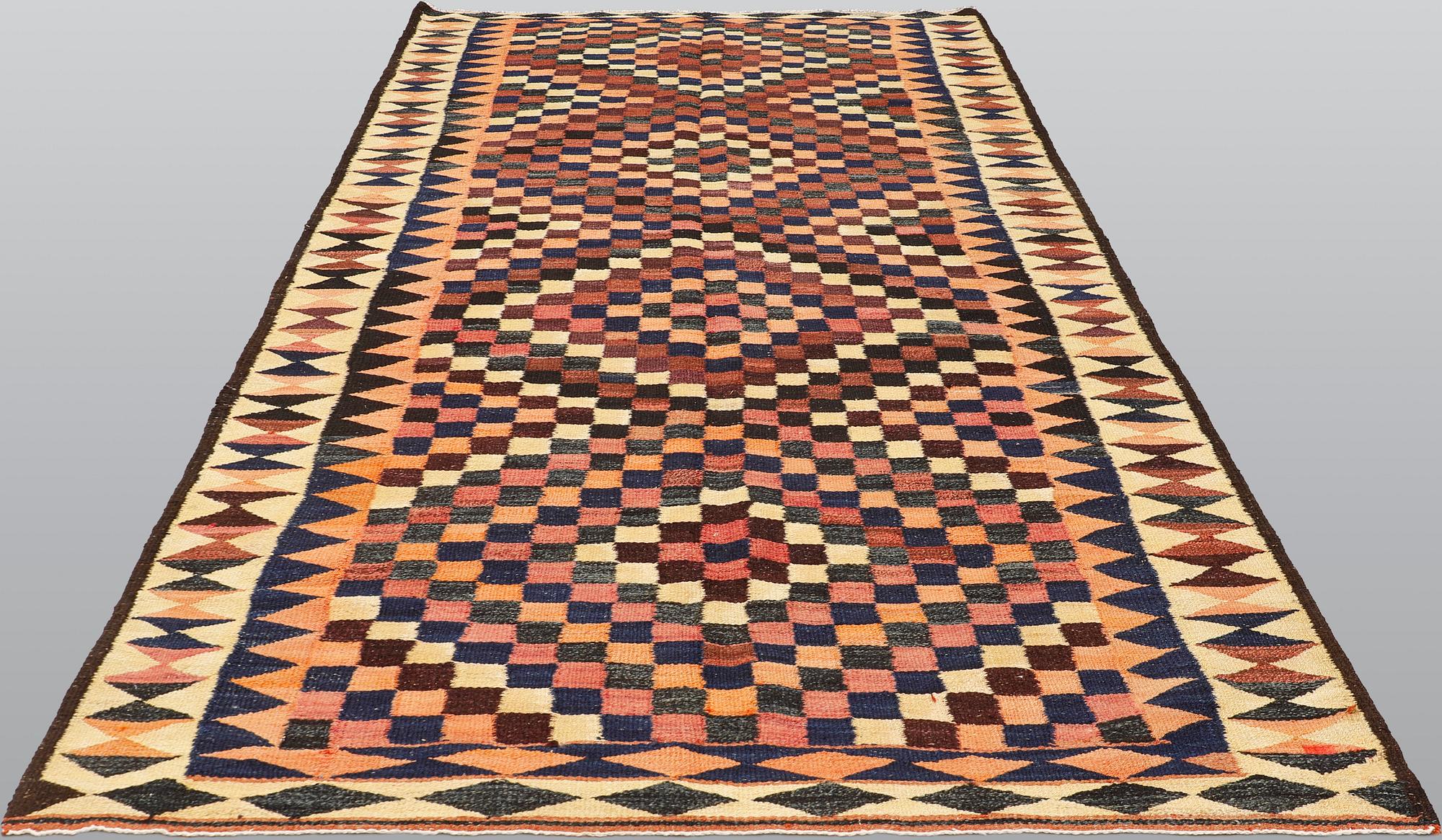 A kilim carpet, ca 333 x 163 cm.