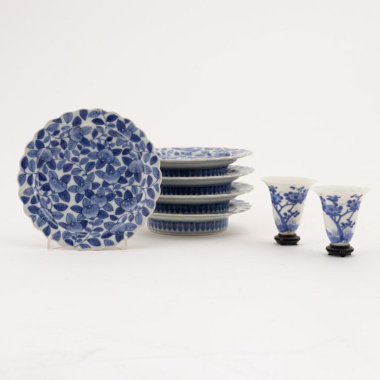 A set of two Japanese blue and white cups and five stands, Meiji period (1868-1912).