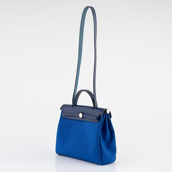Hermès, a 'Herbag Zip 31' handbag in Bleu Saphir Hunter leather and Bleu Billard military canvas, 2021.