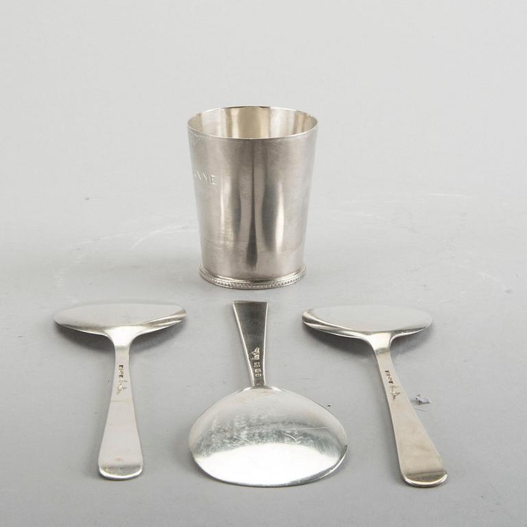 A Swedish 20th century sterling set of three sandwich spoons ad a beaker mark of W Nilsson Lund 1965, 1967 and 1946,