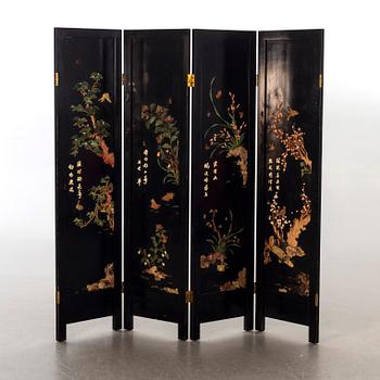 A Japanese 20th century lacquered folding screen with stonework,