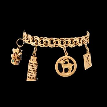 An 18K gold bracelet with charms.