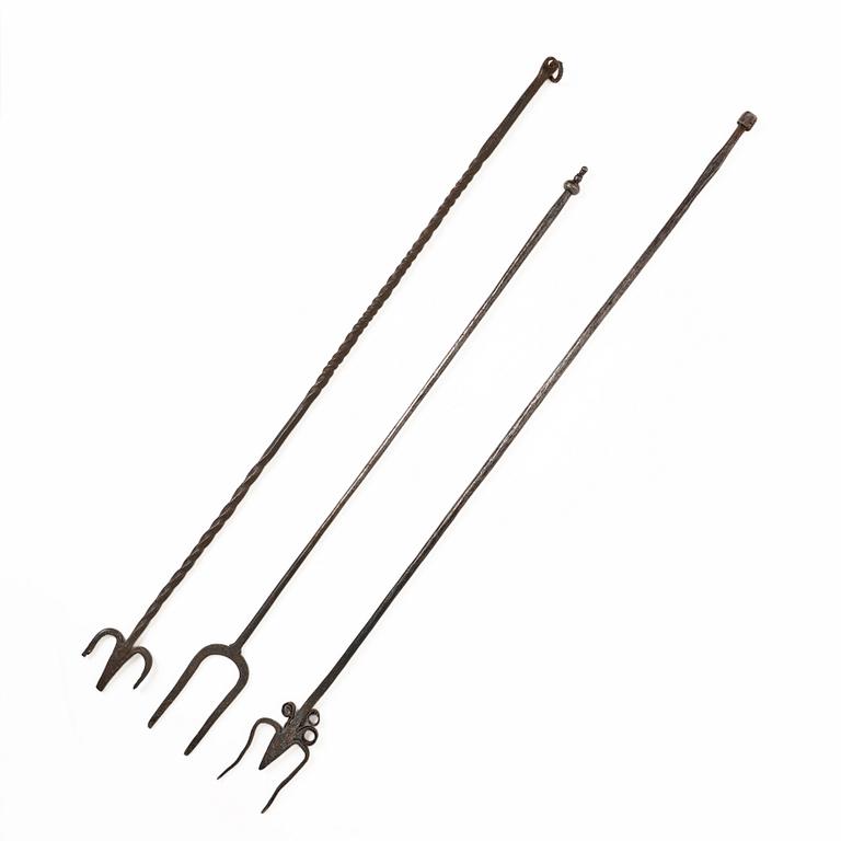 A set of three wrought iron fireplace pokers, 18th / 19th century.