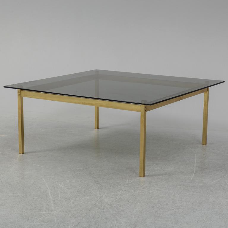 A 1960-70's brass and glass coffee table.