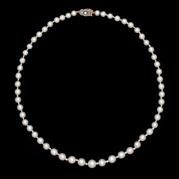 1213. A cultured pearl necklace with diamond clasp, c. 1930's.