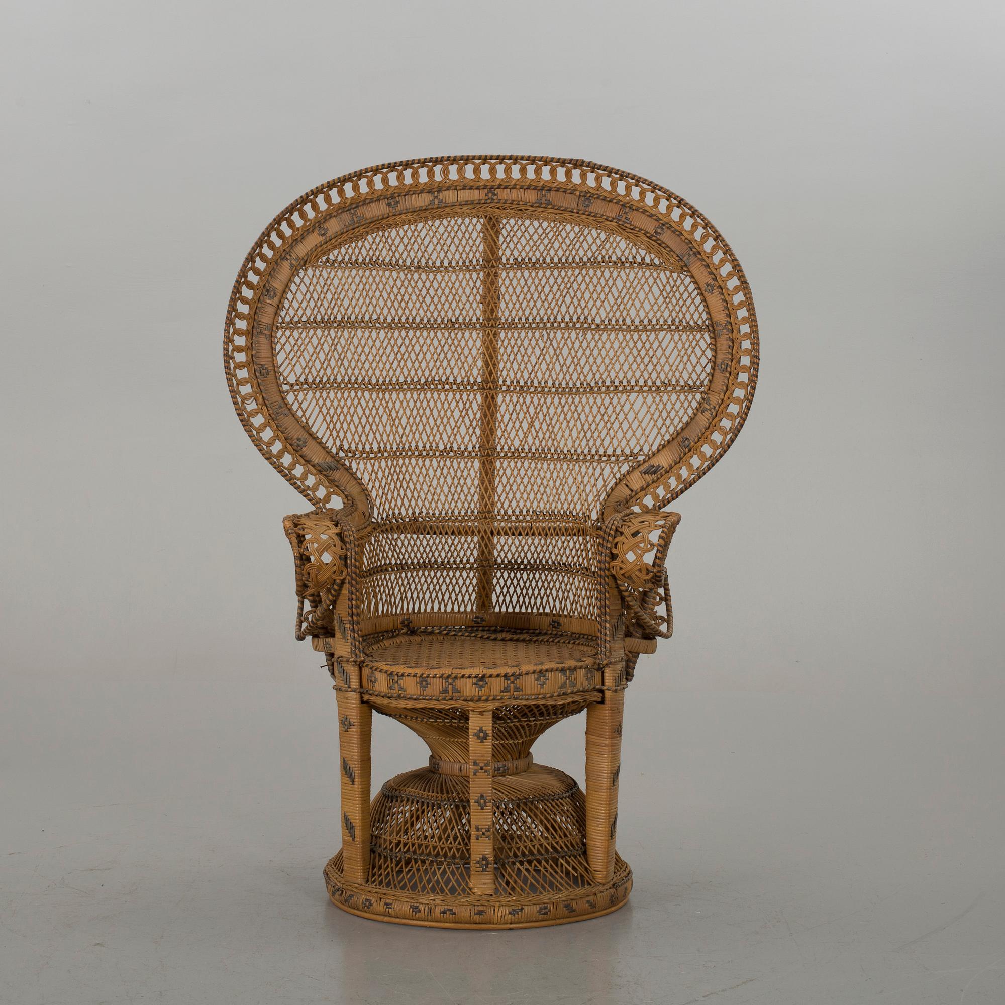 AN RATTAN ARMCHAIR.