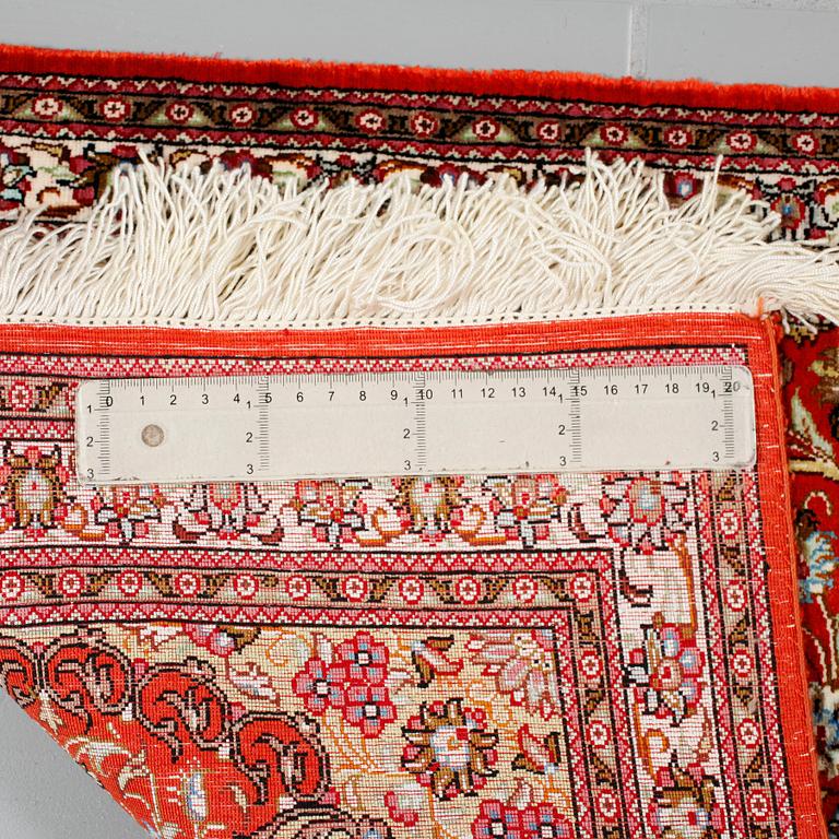A Ghom rug, silk, 145 x 49 cm.