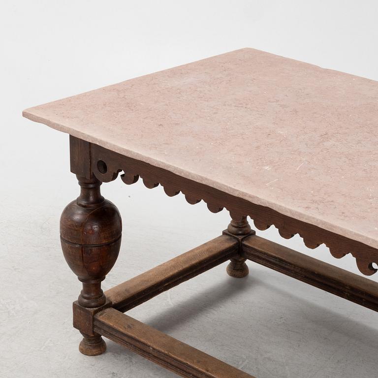 A Baroque oak and stone top table, 18th Century.