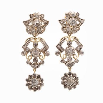 A pair of 18K gold earrings with rose-cut diamonds.