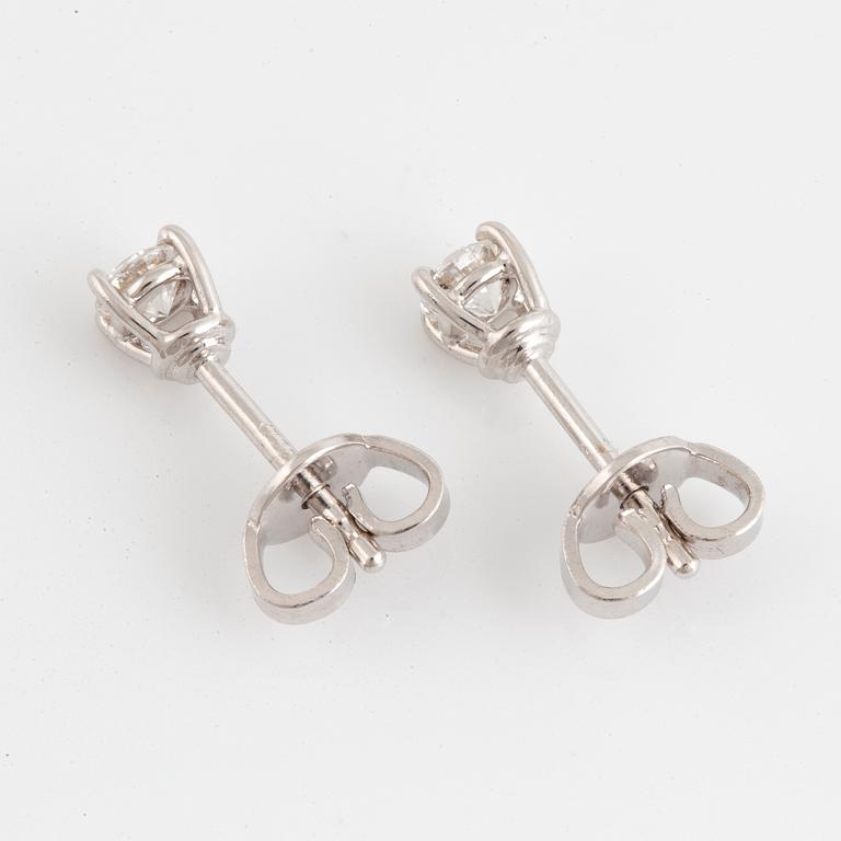 Brilliant-cut diamond stud earrings.