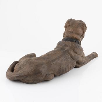 A ceramic sculpture of a dog, 20th century.
