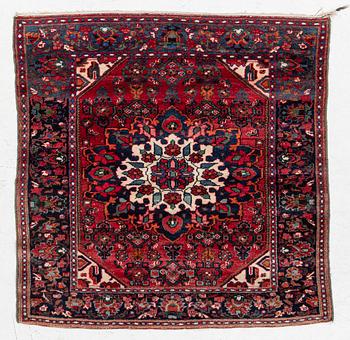 An Old Northwest Persian rug, c. 127 x 125 cm.