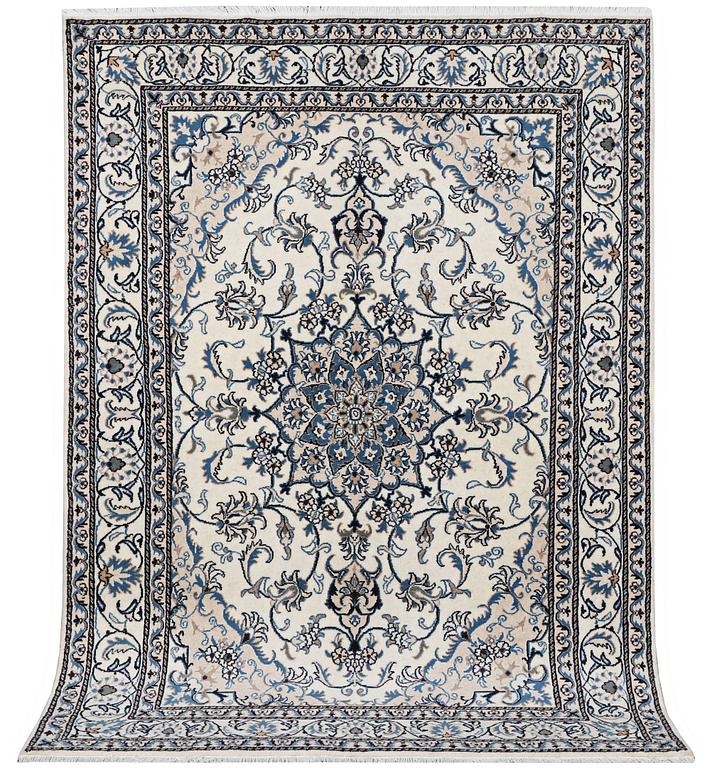 A Nain rug, part silk, c. 242 x 165 cm.