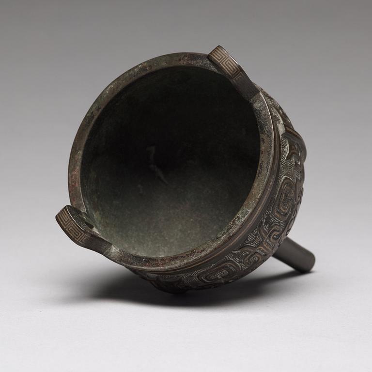 A tripod bronze censer Qing dynasty, 19th Century.