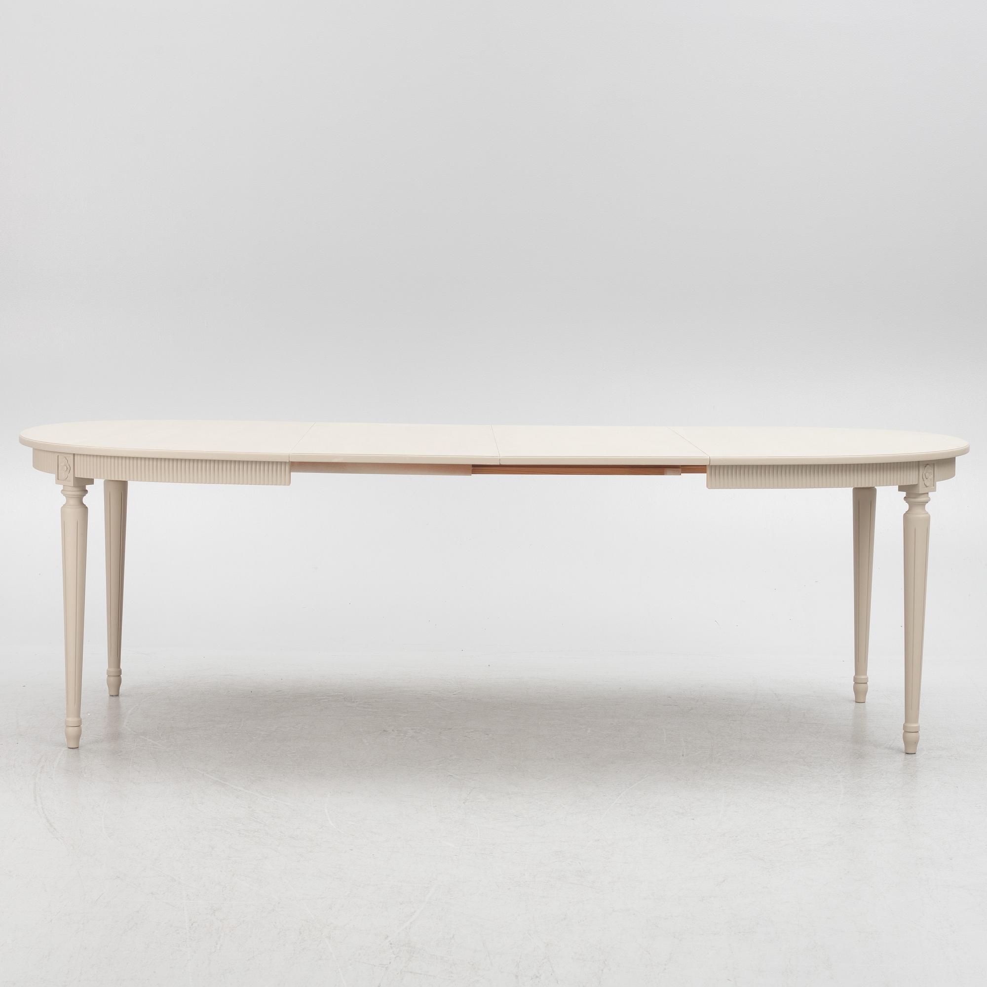 A Gustavian Style Dining Table and 10 Chairs, second half of the 20th Century.