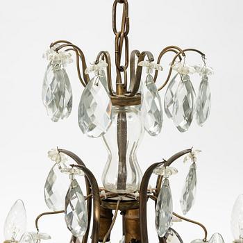 Takkrona, rokokostil, 1900-talets första hälft.