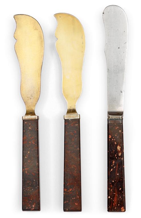 A pair of Swedish porphyry patties knife and a cheese knife, circa 1900.