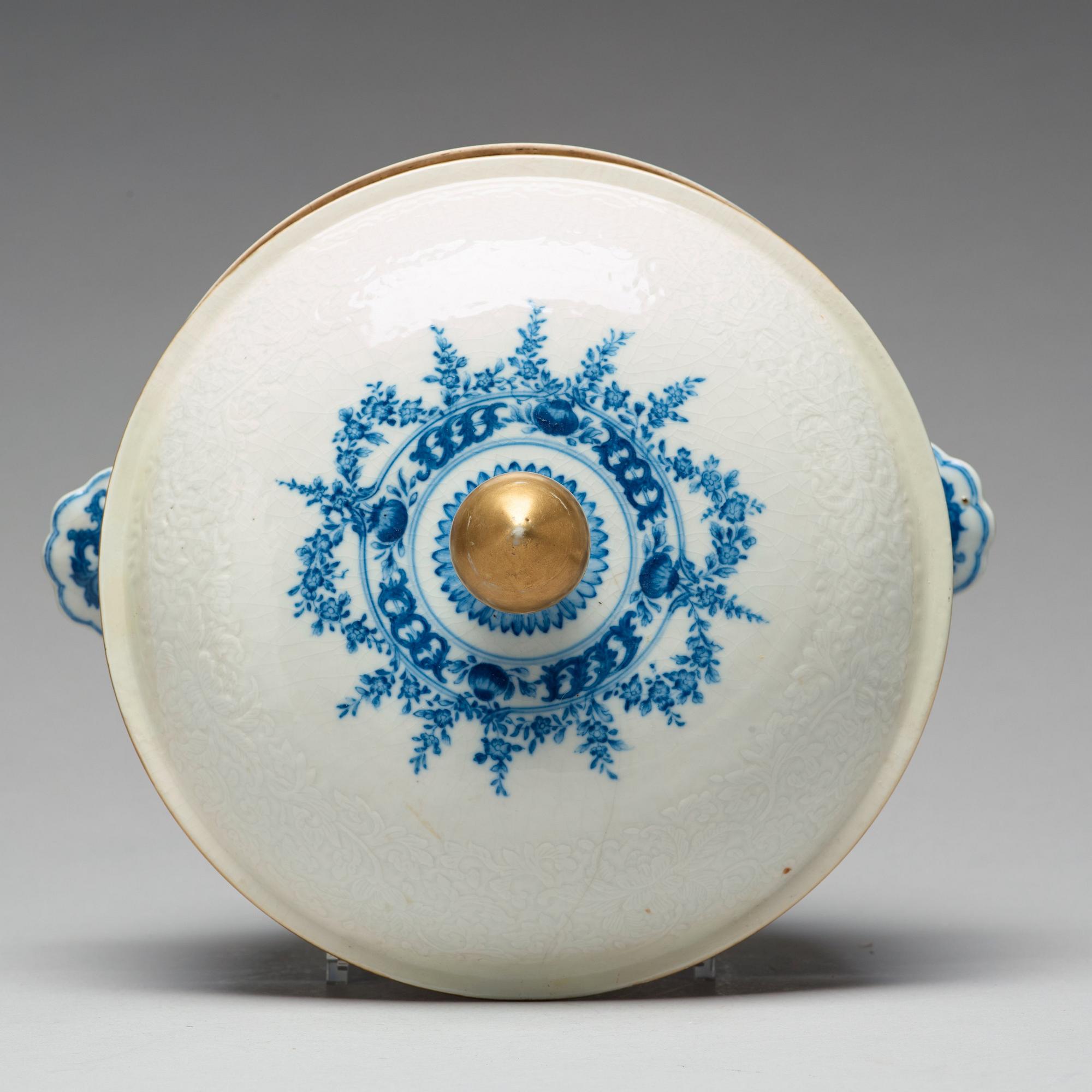 A blue and white armorial tureen with cover, and stand, Qing dynasty, 18th Century.