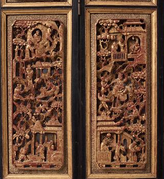 A set of four framed wooden panels, Qing dynasty, 19th Century.