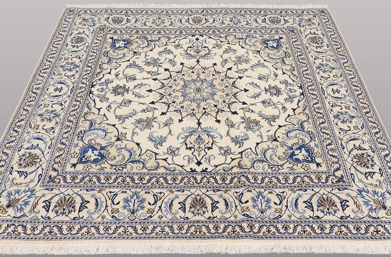 A rug, Nain part silk, ca 197 x 197 cm.