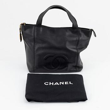 Chanel, a caviar leather tote bag.