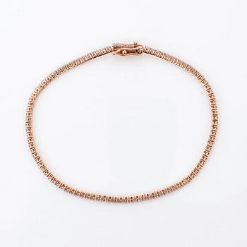 ARMBAND, ett riviére i rosa guld med briljanter, totalt ca 0.99ct.