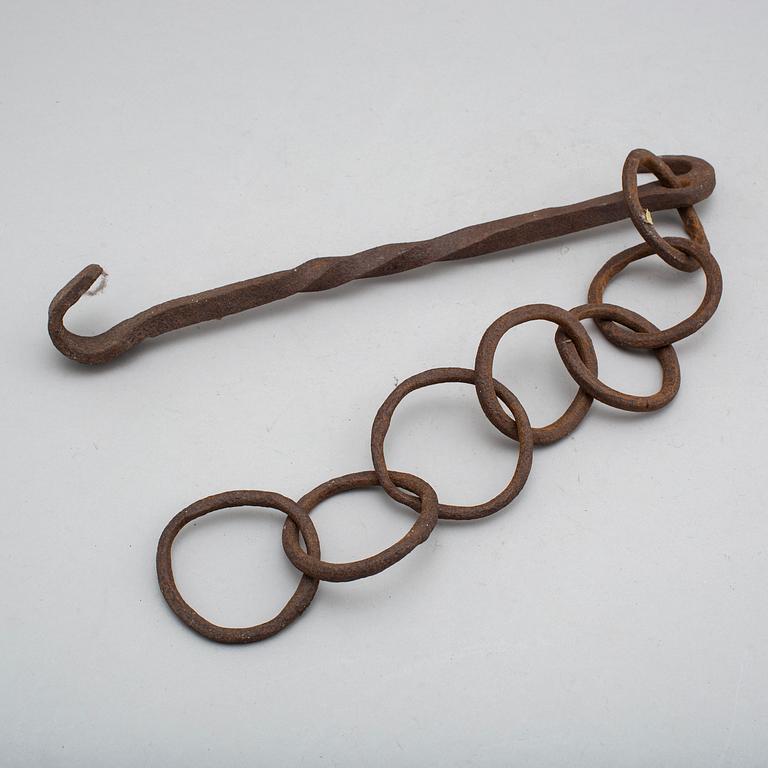 A 19th century iron hook and chain.