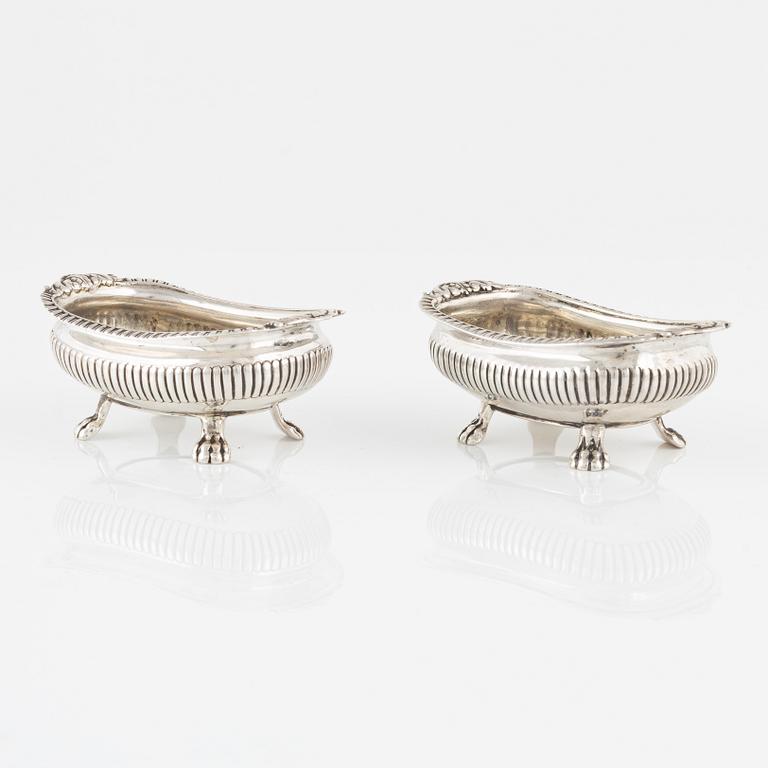 A pair of English Silver Salt Cellars, marks ofJoseph Angell Il 1823 and Samuel Dutton 1826 respectively, London.