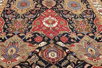 An Oriental carpet with Mamluk design, c. 364 x 276 cm.