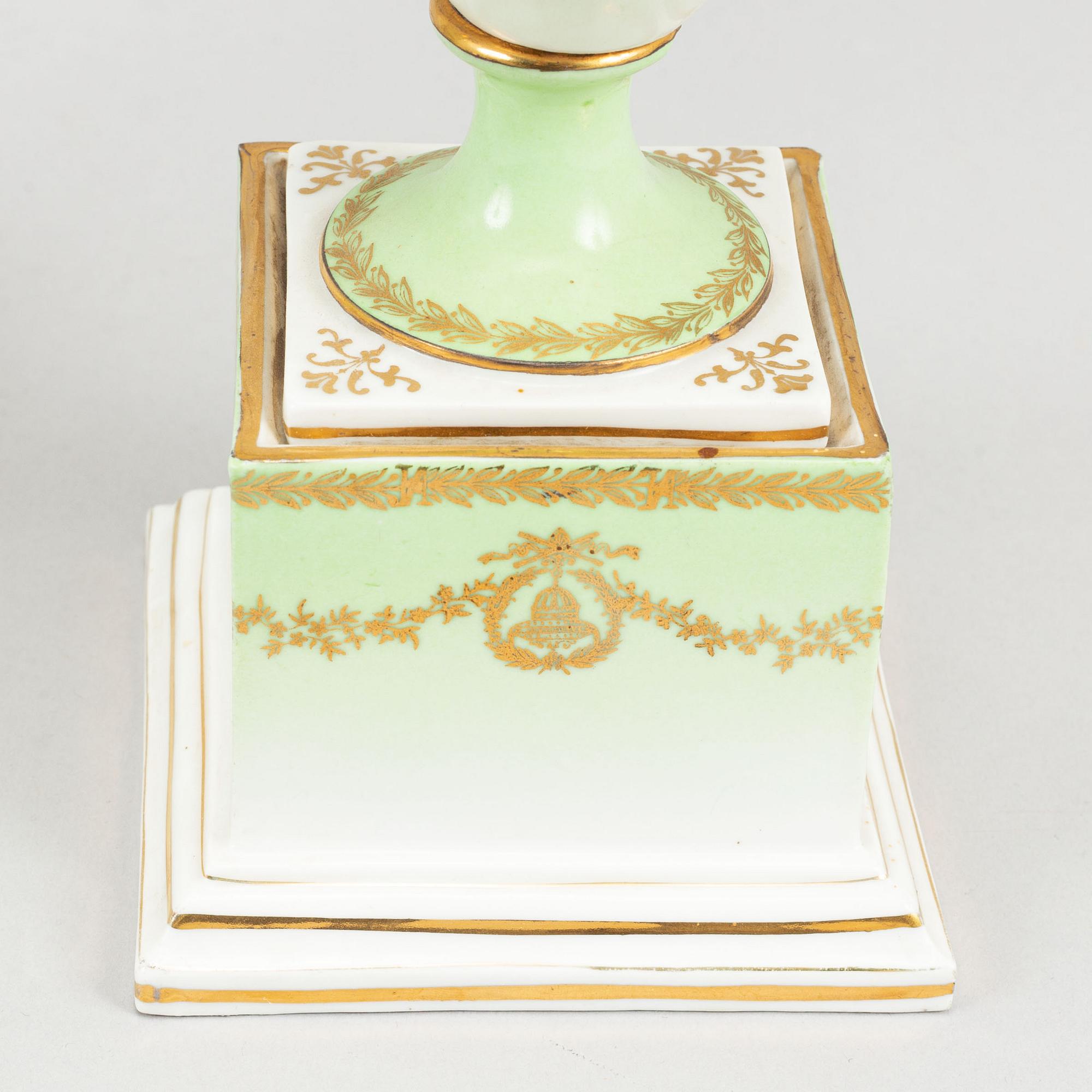 A pair of porcelain urns, possibly naples, first half of the 20th century.