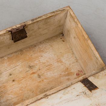 A wooden chest, dated 1856.