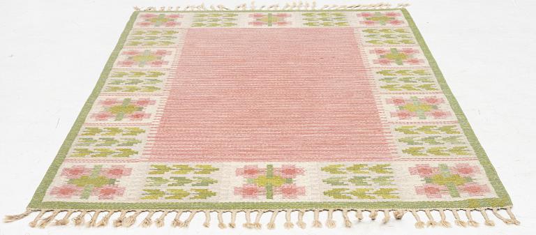 Berit Woelfer, a 'flora' flat weave rug, c. 203 x 136 cm, signed BW.