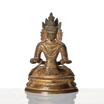 A gilt copper alloy figure of Amitayus, Tibeto - Chinese, 17th/18th century.