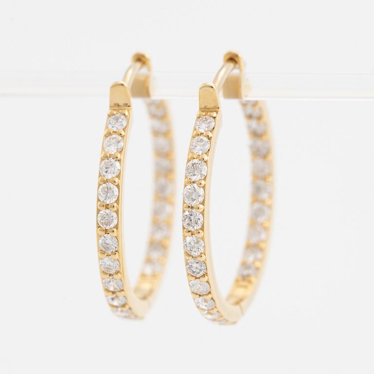 Brilliant cut diamond hoop earrings.