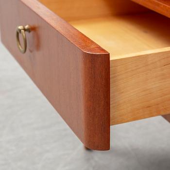 A pair of teak veneered bedside tables, mid 20th century.