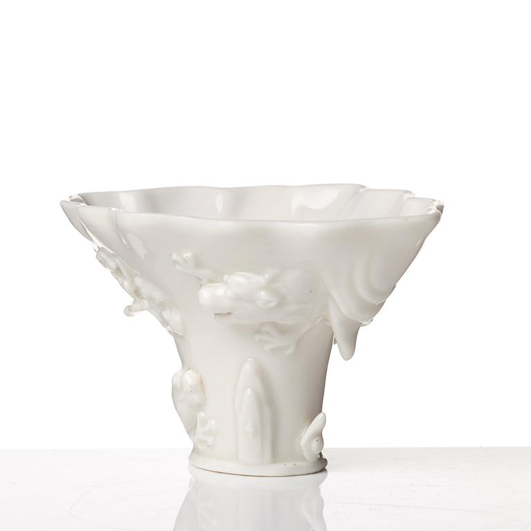 A blanc de chine rhinoserous libation cup, Qing dynasty, Kangxi (1662-1722).