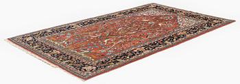 An antique 'Manchester' Kashan rug, central Persia, c 222 x 133 cm.