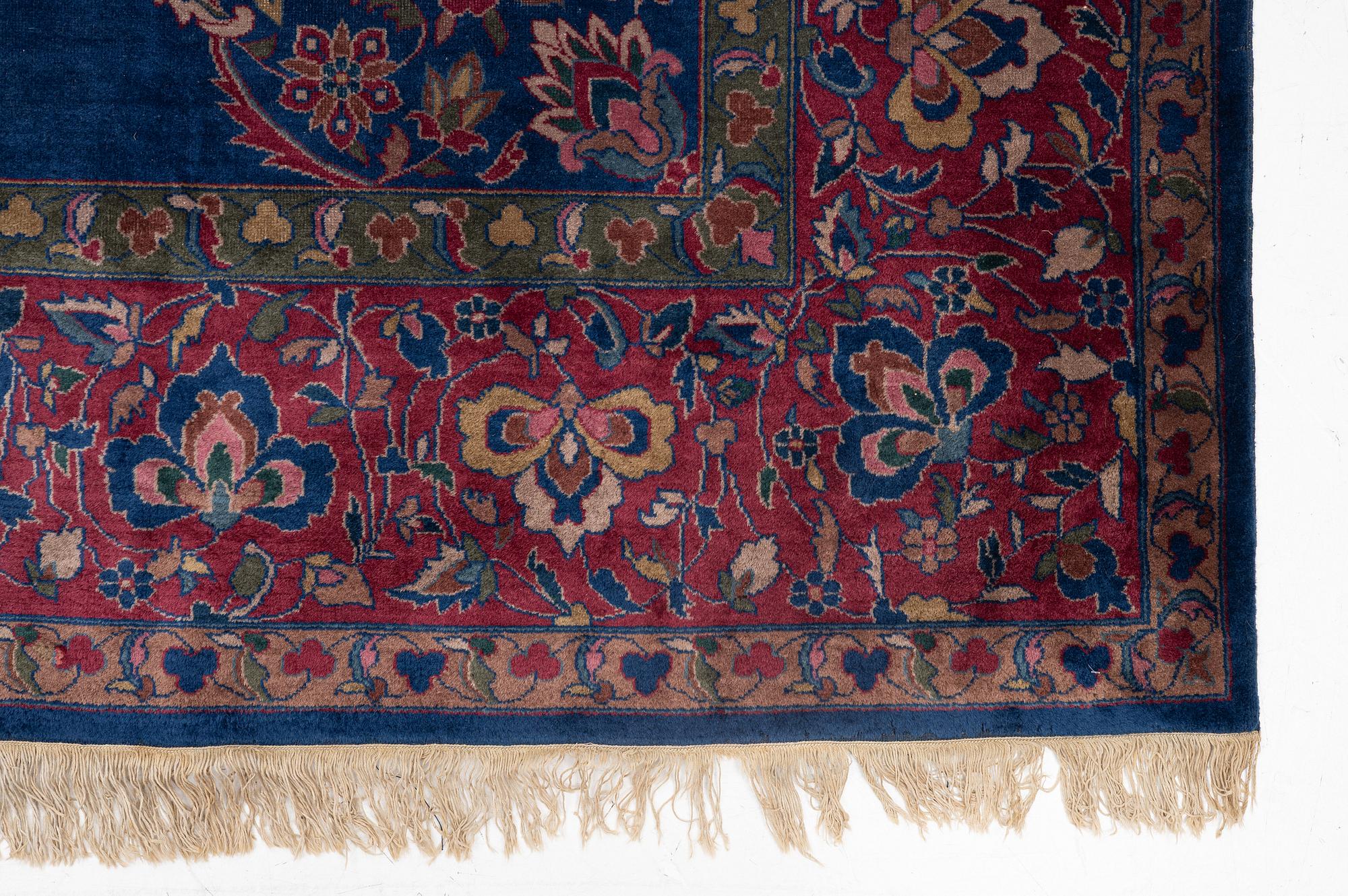 A semi-antique Amritsar carpet, north India c. 359 x 272 cm.