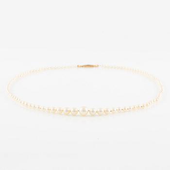 Pearl necklace, with graduated cultured pearls, clasp 18K gold set with small white stones.