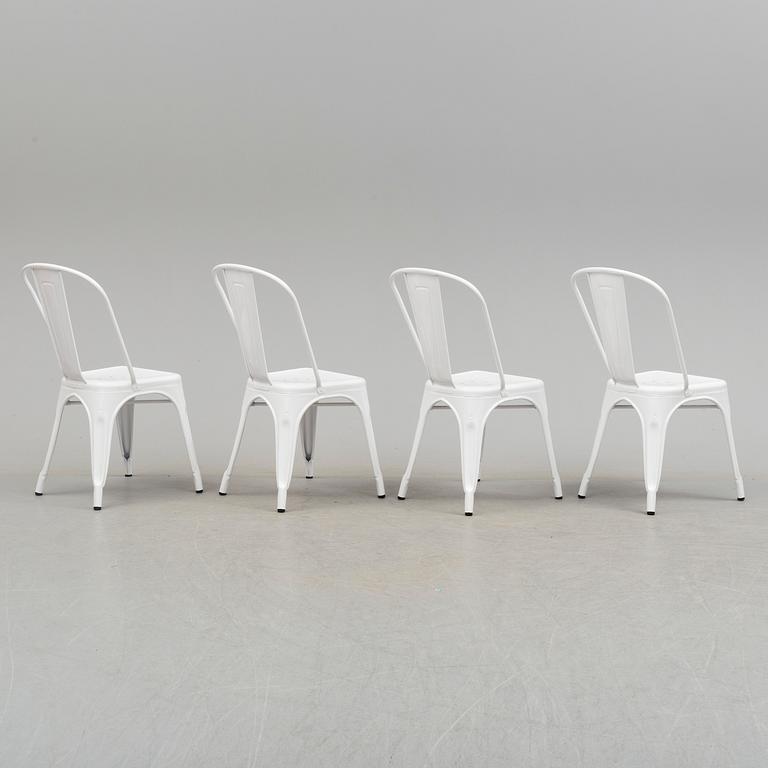 A set of four Tolix chairs.