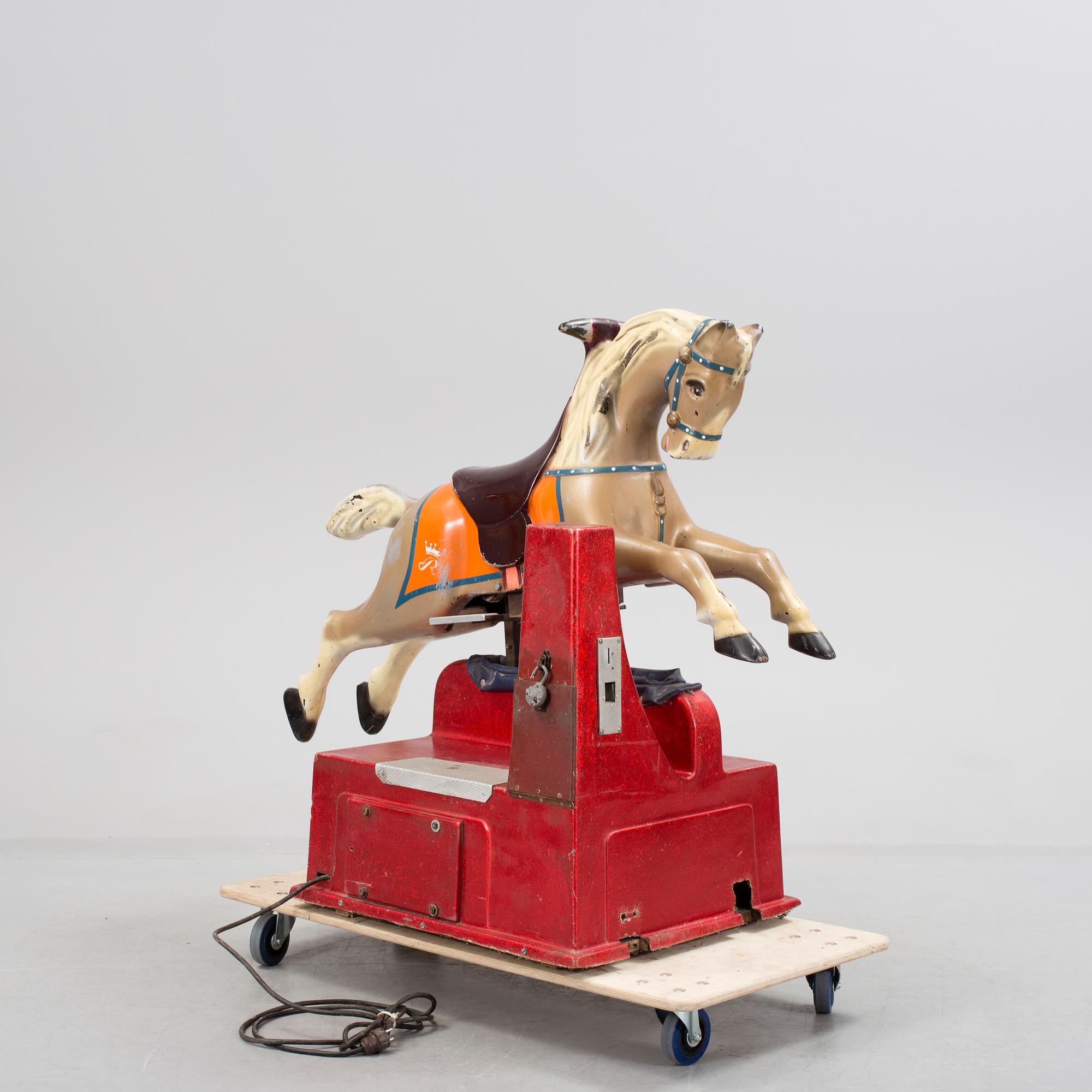 A motorized fiberglass horse probably 1970s.