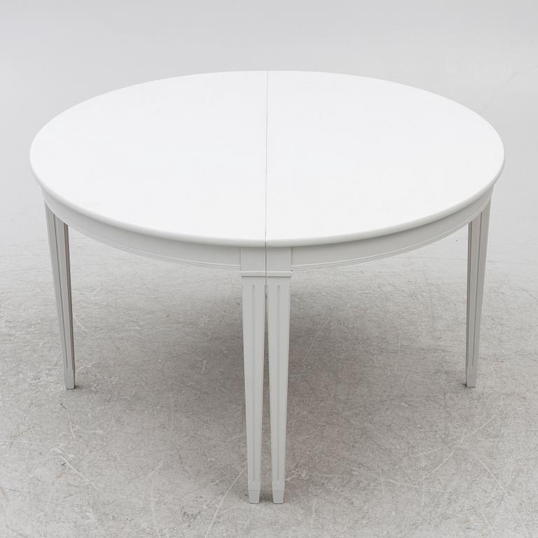A pair of crescent shaped tables, 20th century.