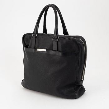 Christian Dior, a black leather briefcase.