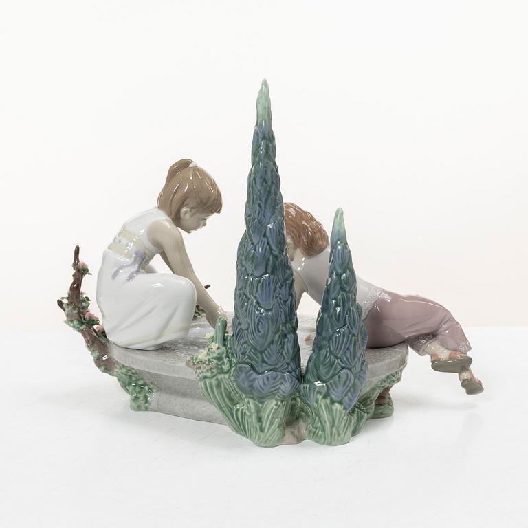 Lladró, three figurines,"Girl with French bulldog", "Girl with Dalmatians" and "Petals in the pond", Spain.