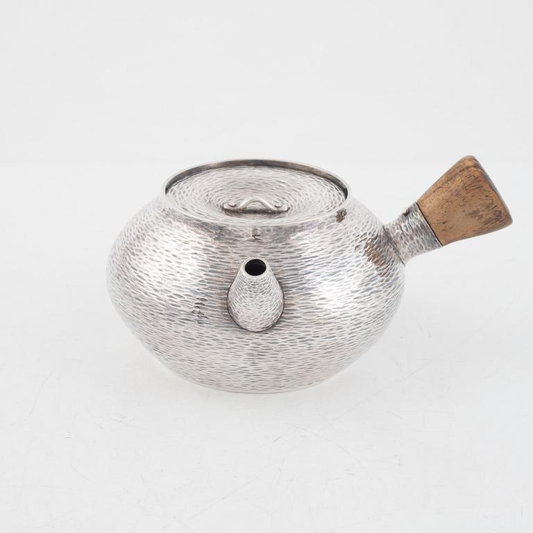 A silver teapot, first part of the 20th century.