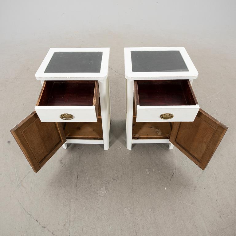 A pair of painted bedside tables from the first half of the 20th century.