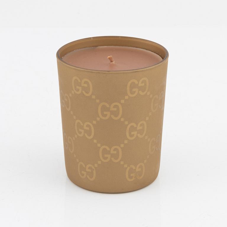 Gucci, a scented candle.