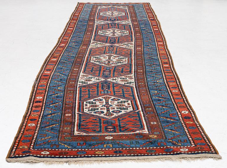An antique Kurdish runner, probably,. 406 x 105 cm.